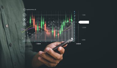 Businessman reveals a growing virtual hologram stock on smartphone, depicting the success and progress of stock market trading. Planning and strategy for business growth. Invest in trading.